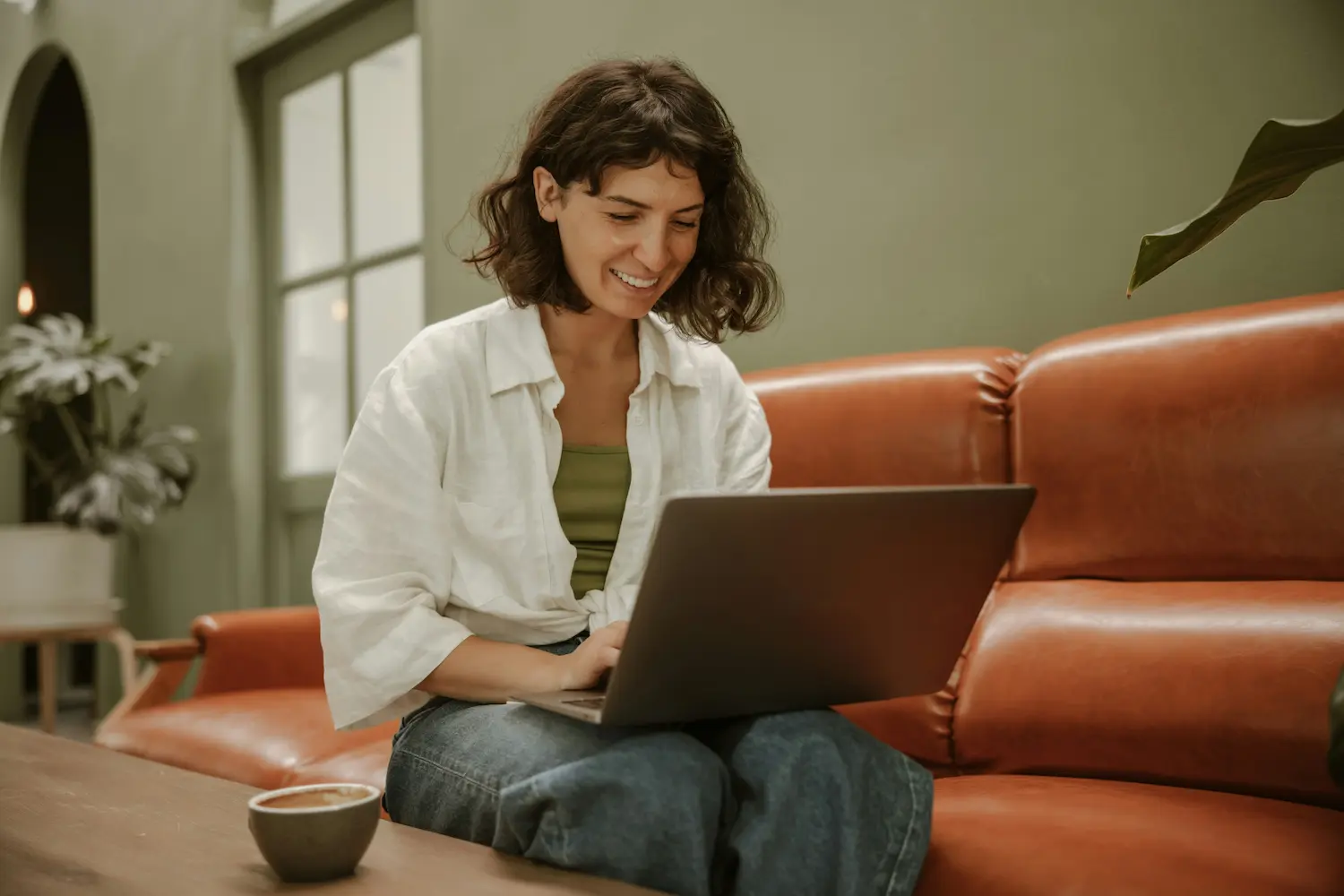 Woman using laptop for interview preparation